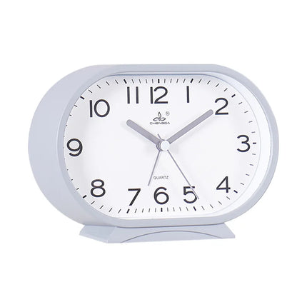Reloj despertador analógico de forma ovalada