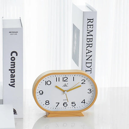 Reloj despertador analógico de forma ovalada